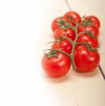 Fresh Cherry Tomatoes On A Cluster Stock Photo