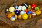 Marbles On Wood Stock Photo