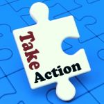 Take Action Puzzle Shows Inspire Inspirational And Motivate Stock Photo