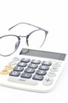 Calculator With Eyeglasses Isolated On White Background Stock Photo