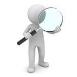 Figure Holding Magnifying Glass Stock Photo