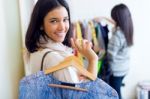 Two Beautiful Girls Shopping In A Clothes Shop Stock Photo