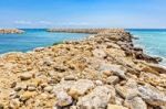 Row Of Stones As  Weir In Greek Sea Stock Photo