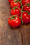 Fresh Cherry Tomatoes On A Cluster Stock Photo