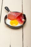 Egg Sunny Side Up With Italian Speck Ham Stock Photo