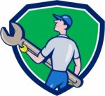 Mechanic Carrying Giant Spanner Crest Cartoon Stock Photo