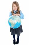 Aerial View Of Cute Girl Kid Holding Globe Stock Photo