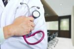 Doctor Holding Stethoscope Stock Photo