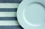 Empty White Plate With Tablecloth Stock Photo