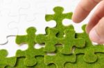 Green Puzzle Piece, Green Space Concept Stock Photo