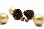 Pine Cone And Acorn With Gold Ball Ornament On White Background Stock Photo