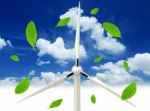 Green Leafs And Wind Turbine Stock Photo