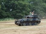 People Enjoying A Ride In An Armoured Car At Dunsfold Airfield Stock Photo