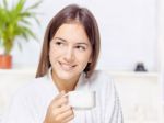 Woman In Bathrobe Relaxing At Home Stock Photo