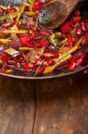 Fried Chili Pepper And Vegetable On A Wok Pan Stock Photo