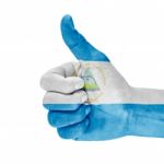 Flag Of Nicaragua On Thumb Up Hand Stock Photo