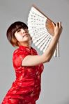 Chinese Model In Traditional Cheongsam Dress Stock Photo