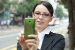 Business Woman Taking A Picture With Mobile Phone Stock Photo