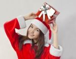 Santa Claus Hat With Red Christmas Gift Box Stock Photo