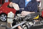 car Mechanic repairing car engine Stock Photo