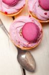 Pink Berry Cream Cupcake With Macaroon On Top Stock Photo