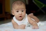 Face Of Newborn Baby Lying On Bed And Open Mouth Wow Stock Photo