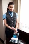 Waitress Opening Bottle Of Beverage Stock Photo