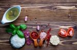 The Ingredients For Homemade Pizza On Shabby Wooden Background Stock Photo