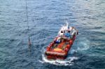 Supply Boat Transfer Cargo To Oil And Gas Industry Stock Photo