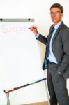 Businessman With Flipchart Stock Photo