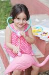 Adorable Little Girl Playing Doctor With Stethoscope Out Door Stock Photo