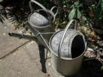 Two Old Watering Cans Stock Photo