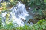 The Water Flowing Over Rocks And Trees Down A Waterfall At Huay Mae Khamin Waterfall National Park ,kanchana Buri In Thailand Stock Photo