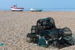 Lobster Pots And Fishing Boats On The Beach At Dungeness Stock Photo