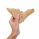 Closeup Of Woman Hand Holding A Sandwich Stock Photo