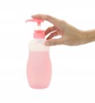 Hand Press Bottle Pump On White Background Stock Photo