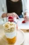 Beautiful Young Woman Preparing Breakfast At Home Stock Photo