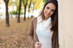 Beautiful Girl Looking At Camera In Autumn Stock Photo