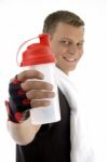 Smiling man Showing Bottle Stock Photo