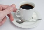 Hand Takes Coffee Cup Stock Photo