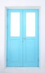 Light Blue Wooden Door With Cement Wall Stock Photo