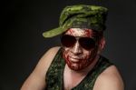 Military Style Camouflage On The Soldier's Face Stock Photo