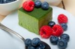 Green Tea Matcha Mousse Cake With Berries Stock Photo