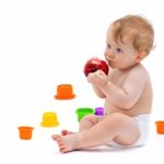 Cute Infant Boy With Apple Stock Photo