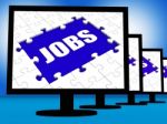 Jobs On Monitors Shows Jobless Employment Or Hiring Online Stock Photo