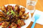 Part Of Spicy Herb Fried Chicken Wings On The Table Stock Photo