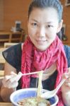 Asian Woman Is Eating Noodles Stock Photo