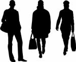 Silhouette men carrying bags Stock Photo