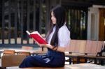 Asia Thai High School Student Uniform Beautiful Girl Read A Book Stock Photo