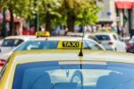 Yellow Taxi Sign On Cab Vehicle Roof Stock Photo